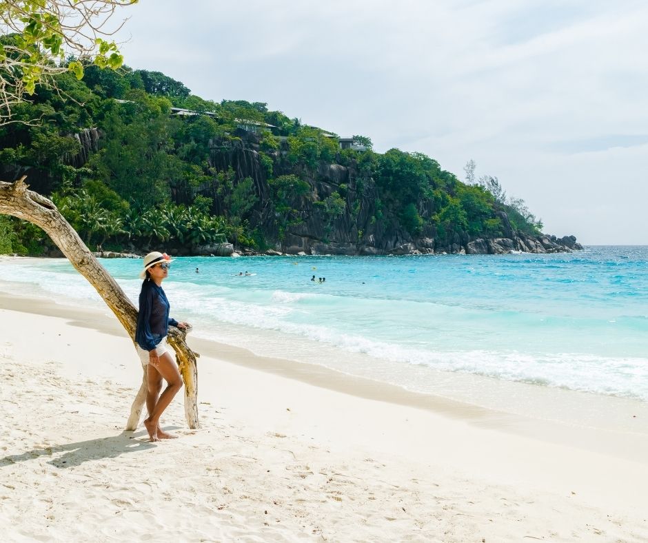 Young Women at a Tropical Beach Petite Anse Beach Mahe Seychelles Islands