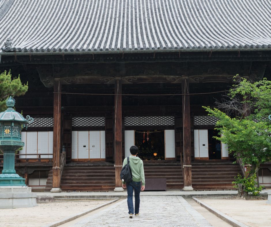 Solo traveler visits a famous temple in Japan